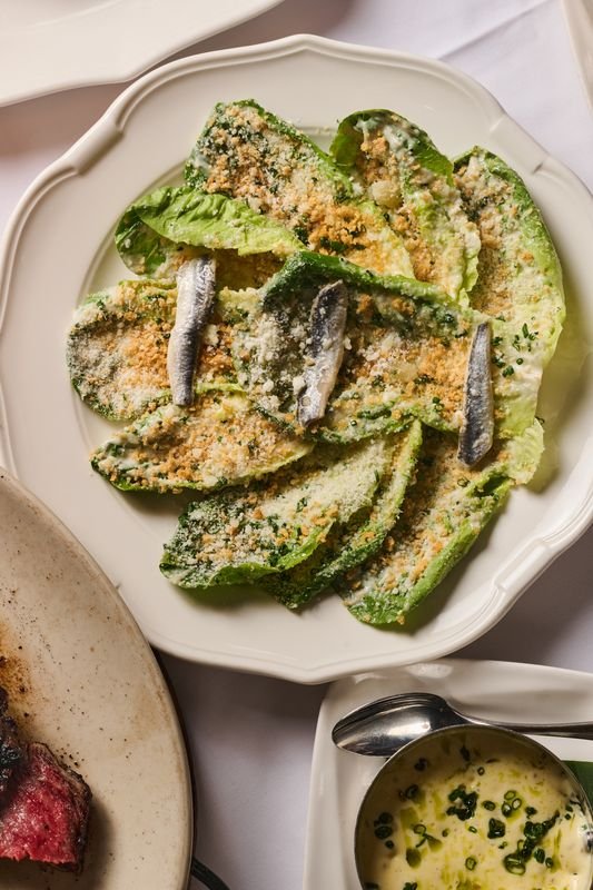A plate of crisp romaine with white anchovies at the reopened Delmonico's